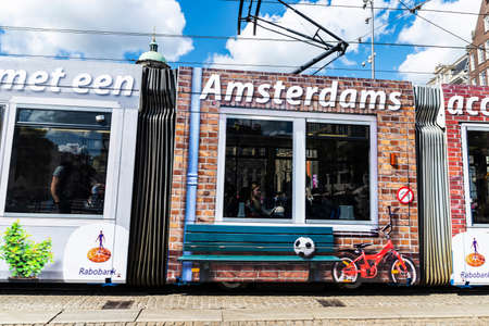 Amsterdam, Netherlands - September 7, 2018: Tram circulating with passengers in the old historic center of Amsterdam, Netherlandsのeditorial素材