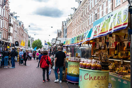 Amsterdam, Netherlands - September 8, 2018: Albert Cuyp Market, street market with people around in...