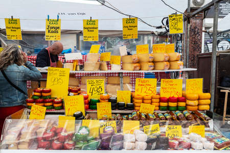 Amsterdam, Netherlands - September 8, 2018: Vendor in a cheese shop in Albert Cuyp Market, street market in Amsterdam, Netherlandsのeditorial素材
