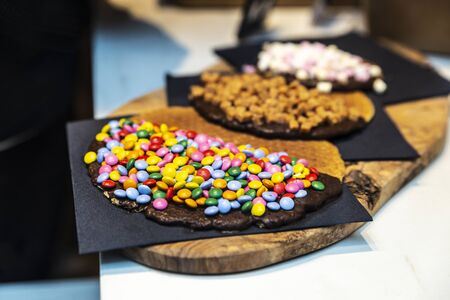 Display of a candy store with a great assortment of cookies with chocolate in Amsterdam, Netherlandsの写真素材