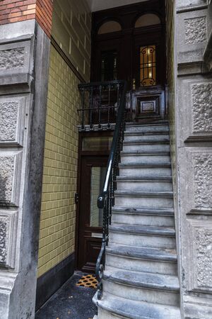Classic doorway of an old traditional leaning house in the old town of Amsterdam, Netherlandsの写真素材