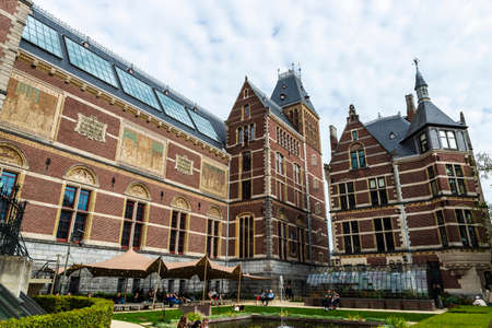 Amsterdam, Netherlands - September 9, 2018: Garden of the Rijksmuseum (National Museum) with people...