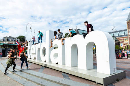 Amsterdam, Netherlands - September 9, 2018: Big corporeal sign of I Amsterdam with people around in...