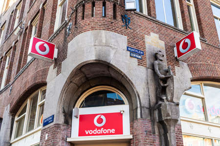 Amsterdam, Netherlands - September 9, 2018: Vodafone shop in a classic building in Amsterdam,...