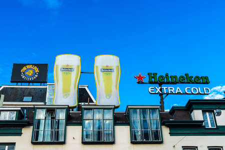 Amsterdam, Netherlands - September 9, 2018: Sign of Heineken brewery and the Bulldog cannabis coffee shop in the centre of Amsterdam, Netherlandsのeditorial素材