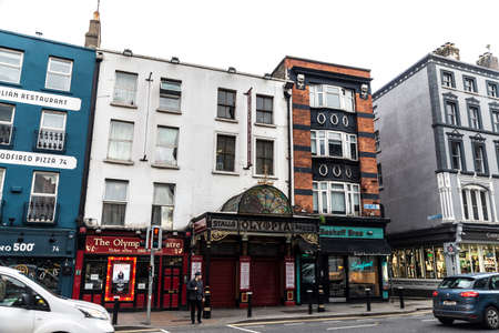 Dublin, Ireland - December 30, 2019: Facade of the Olympia Theatre in Dame Street with people around...