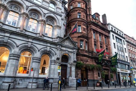 Dublin, Ireland - December 30, 2019: Dame Street with shops, restaurants, irish pub and people around in the center of Dublin, Irelandのeditorial素材