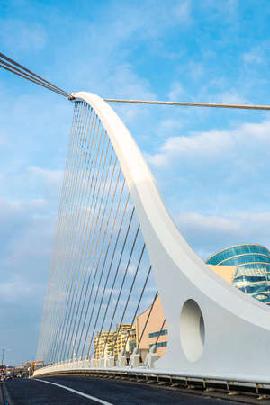 Dublin, Ireland - January 1, 2020: Samuel Beckett Bridge, designed by the architect Santiago Calatrava, and the Convention Center Dublin, on the river Liffey in Grand Canal Dock, Dublin, Irelandのeditorial素材