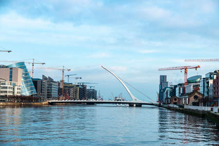 Dublin, Ireland - January 1, 2020: Samuel Beckett Bridge, designed by the architect Santiago Calatrava, and the Convention Center Dublin, on the river Liffey in Grand Canal Dock, Dublin, Irelandのeditorial素材