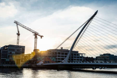 Dublin, Ireland - January 1, 2020: Samuel Beckett Bridge, designed by the architect Santiago Calatrava, at sunset on the river Liffey in Grand Canal Dock, Dublin, Irelandのeditorial素材
