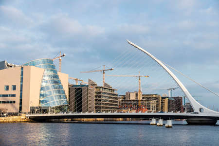 Dublin, Ireland - January 1, 2020: Samuel Beckett Bridge, designed by the architect Santiago Calatrava, and the Convention Center Dublin, on the river Liffey in Grand Canal Dock, Dublin, Irelandのeditorial素材