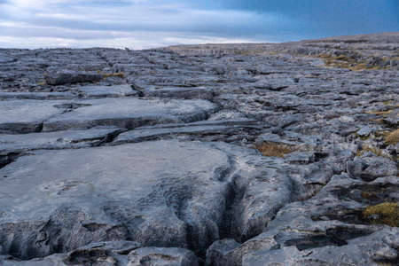 Karst landscape of the Burren at sunset in County Clare, province of Munster, bordered on the west by the Atlantic Ocean, on the coast of Irelandの素材 [FY310159960678]