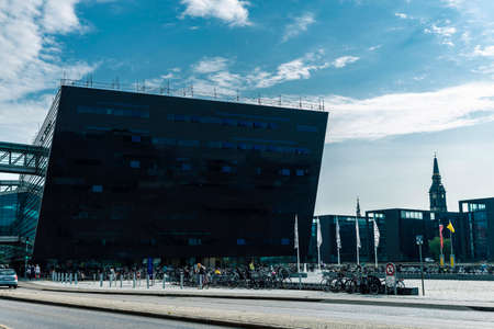 Copenhagen, Denmark - August 27, 2019: Facade of the The Royal Library in the Black Diamond building, modern glass office building, with people around in Copenhagen, Denmarkのeditorial素材