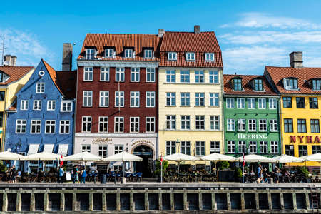 Copenhagen, Denmark - August 27, 2019: People drinking on a terrace bar along of a canal in Nyhavn, Copenhagen, Denmarkのeditorial素材