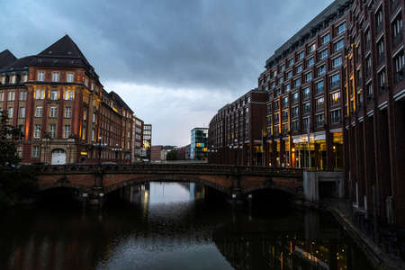 Hamburg, Germany - August 15, 2019: Modern and classic buildings next to a canal and the bridge called HeiligengeistbrÃ¼cke in the neighborhood of Neustadt, in the center of Hamburg, Germanyのeditorial素材
