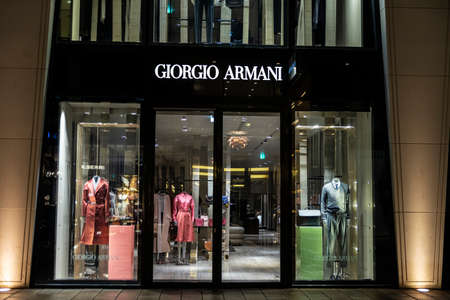 Hamburg, Germany - August 15, 2019: Display of a Giorgio Armani luxury clothing store at night on Neuer Wall street in Hamburg, Germanyのeditorial素材