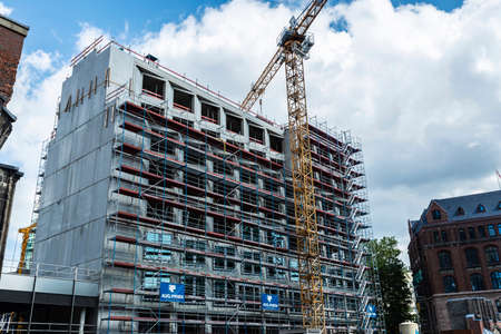 Hamburg, Germany - August 21, 2019: Metal scaffold with a crane construction on a skyscraper in Hamburg, Germanyのeditorial素材