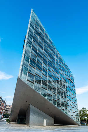 Low angle shot of The Crystal (Krystallen) designed by Schmidt Hammer Lassen, modern office building of the Nykredit headquarters, financial services company in Copenhagen, Denmark.のeditorial素材