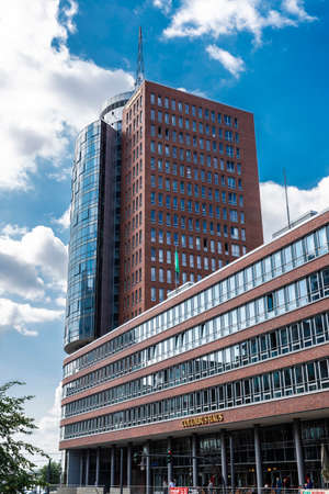 Hamburg, Germany - August 21, 2019: Hanseatic Trade Center (HTC), modern office building with people...