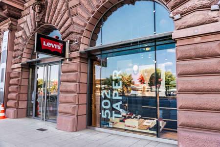Hamburg, Germany - August 25, 2019: Facade of a Levis clothing store and a chemist shop in Jungfernstieg, shopping street in Neustadt, Hamburg, Germanyのeditorial素材