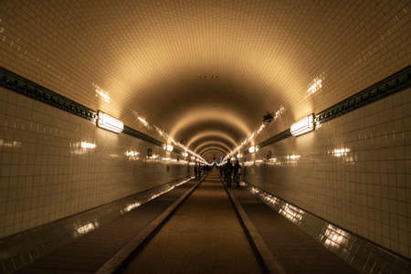 Old Elbe Tunnel or St. Pauli Elbe Tunnel (Alter Elbtunnel) with people around in Hamburg, Germanyのeditorial素材