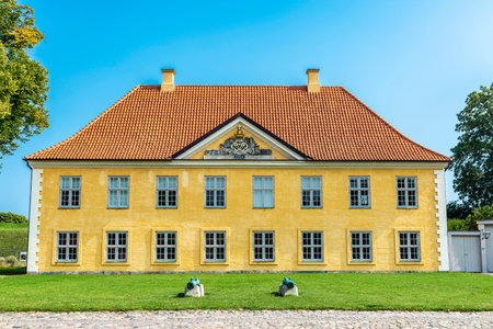 Facade of the The Commander House with two old cannons in Kastellet (The Citadel), Copenhagen, Denmarkのeditorial素材
