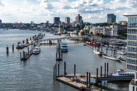 Hamburg, Germany - August 21, 2019: Overview of the pier on the Elbe river with cruise ships, boats and sailboats in St. Pauli, Hamburg, Germanyのeditorial素材