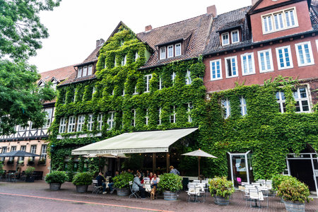 Hanover, Germany - August 18, 2019: Street with a bar and restaurant terrace and people around in Hanover, Germanyのeditorial素材