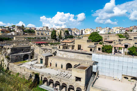 View of the roman ruins of the ancient archaeological site of Herculaneum and the town of Ercolano, Italyの写真素材