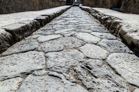 Street paving stones as background in the ruins of the ancient archaeological site of Herculaneum in Ercolano, Italyの写真素材
