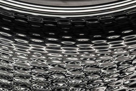 Blurred shiny metal surface like a sea as abstract backgroundの写真素材