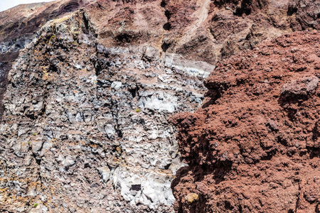 View of a human face in the rocks of the Mount Vesuvius on summer, an active volcano located in...