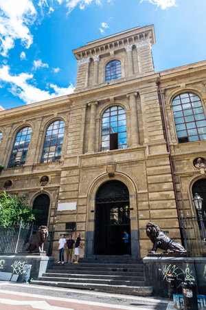 Naples, Italy - September 9, 2019: Facade of the Accademia di Belle Arti di Napoli (Naples Academy of Fine Arts) with people around, an old classic building in Naples, Italyのeditorial素材