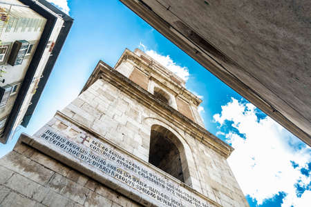 Bell tower of the religious complex of the church of the Santa Chiara in the historical center of Naples, Italyの写真素材