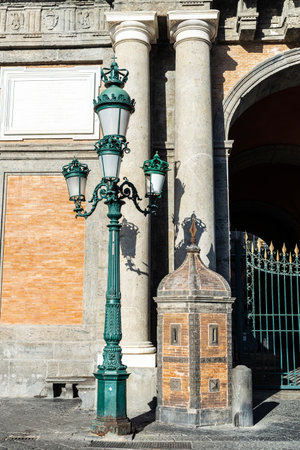 Sentry box and a classic retro lamppost of the Royal Palace of Naples (Palazzo Reale di Napoli) in Piazza del Plebiscito, Italyのeditorial素材
