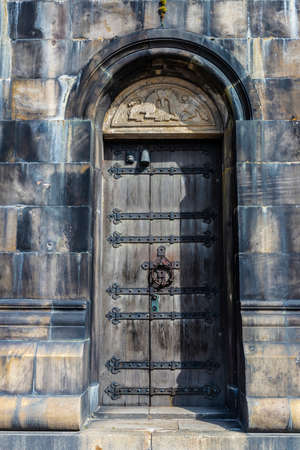 Old wooden door of the Lund Cathedral, Lutheran church in Lund, Scania, Swedenの写真素材