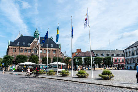 Lund, Sweden - August 30, 2019: Stortorget square with shops and people around in Lund, Scania,...