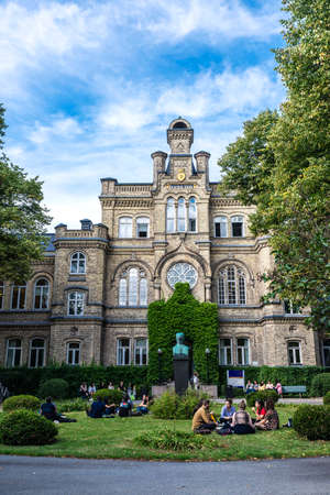 Lund, Sweden - August 30, 2019: Facade of the Gamla kirurgen with people around on summer in the Lund University in Lund, Scania, Swedenのeditorial素材