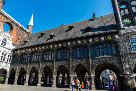 LÃ¼beck, Germany - August 24, 2019: LÃ¼beck Town Hall with people around on Market Square in LÃ¼beck, Germanyのeditorial素材