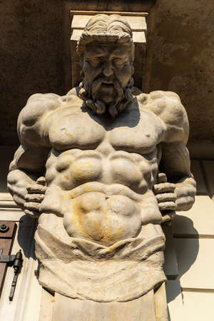 Facade with classical Greek-style sculptures of the Warsaw University or Uniwersytet Warszawski in Krakowskie Przedmiescie in the old town of Warsaw, Polandの写真素材