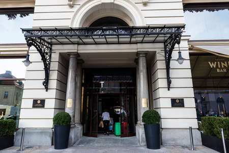 Warsaw, Poland - September 1, 2018: Entrance of the Hotel Bristol, a Luxury Collection Hotel in Krakowskie Przedmiescie with people around in the old town of Warsaw, Polandのeditorial素材