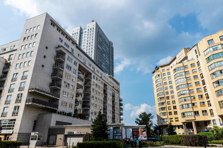 Warsaw, Poland - September 2, 2018: Facade of modern residential buildings with people around in Warsaw, Polandのeditorial素材