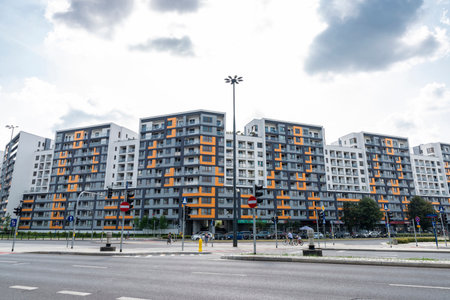 Warsaw, Poland - September 2, 2018: Facade of modern residential buildings with people around in Warsaw, Polandのeditorial素材