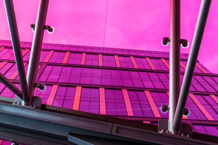 Magenta color structure as abstract background in an entrance of an underground station in Warsaw,...