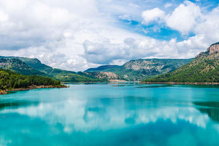 Calm water on the Arenos Reservoir in Puebla de Arenoso and Montanejos, Castellon, Land of Valencia, Spainの写真素材