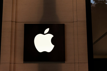 Vienna, Austria - October 16, 2022: Closeup of the sign of an Apple store at night in Innere Stadt, Vienna, Austriaのeditorial素材