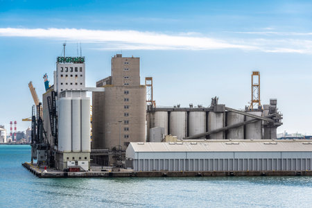Barcelona, Spain - April 17, 2023: Large silos at the loading dock of the port of Barcelona, Catalonia, Spainのeditorial素材