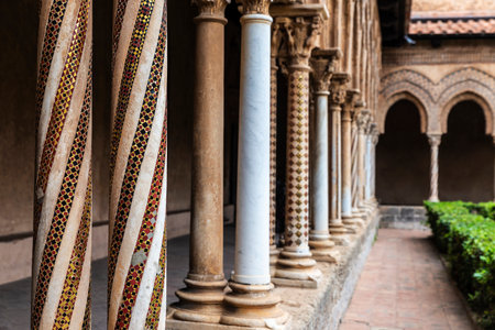 Decorated columns of the cloister of the Benedictine Monastery of Monreale next to the cathedral in the old town of Monreale, Palermo, Sicily, Italyの写真素材