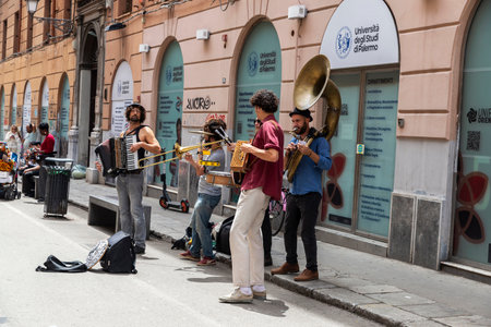 Palermo, Italy - May 13, 2023: Group of musicians playing in the shopping street called Via Maqueda with people around in the old town of Palermo, Sicily, Italyのeditorial素材