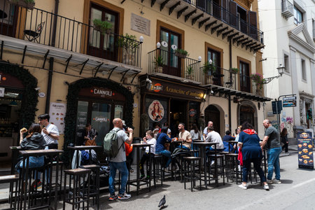 Palermo, Italy - May 13, 2023: Terrace of a restaurant bar in Via Maqueda with people around in the old town of Palermo, Sicily, Italyのeditorial素材